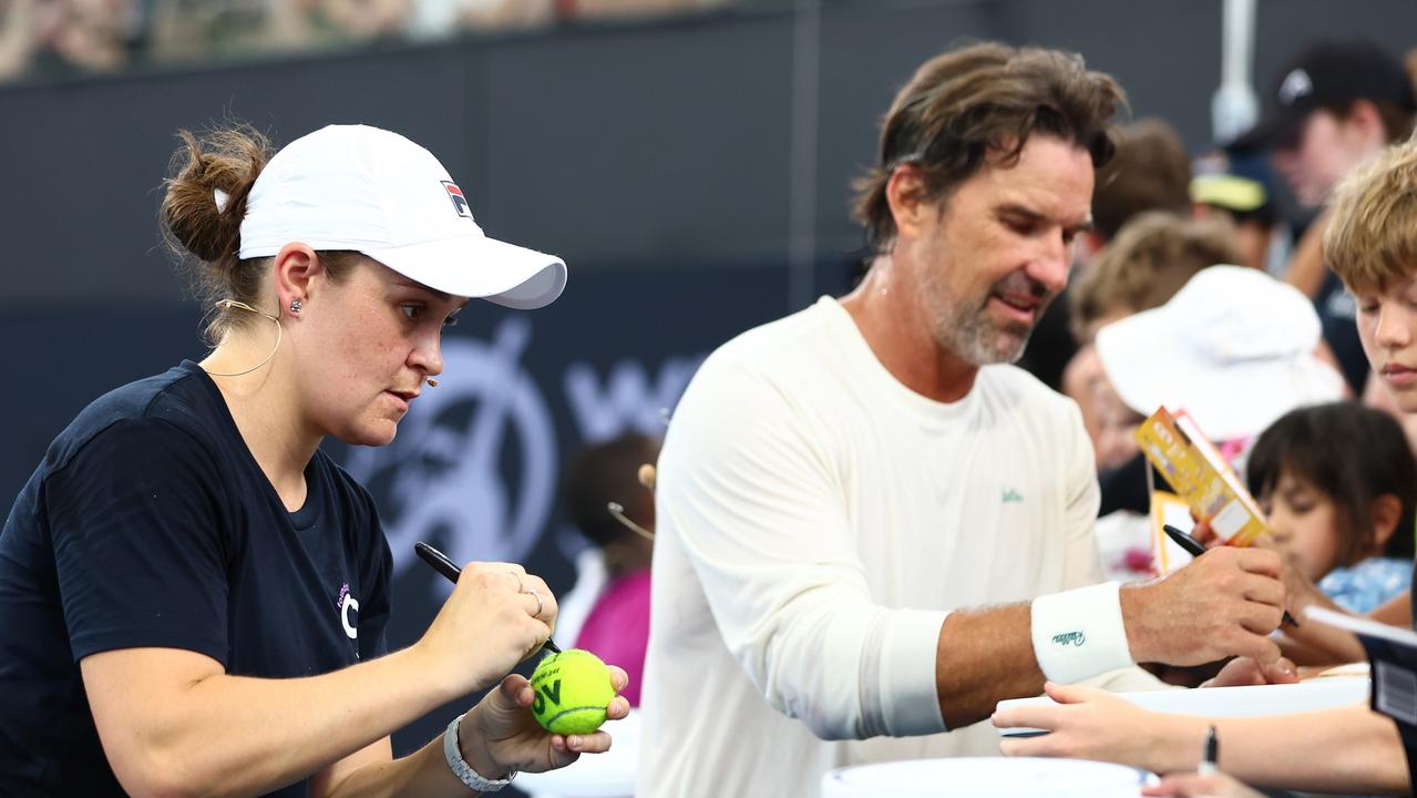 Ash Barty and Pat Rafter sign autographs for fans in Brisbane. Picture: Chris Hyde/Getty Images