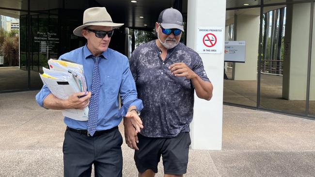 Roy Waters (right) leaves the Darwin Local Court with his lawyer Peter Maley after being committed to stand trial charged with importing child abuse material.