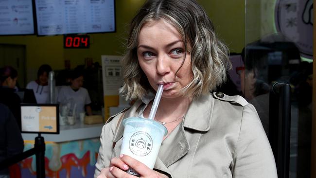 Delicious Sydney editor Sally Coates tries a Yomie’s Yogurt x Rice drink. Picture: Toby Zerna