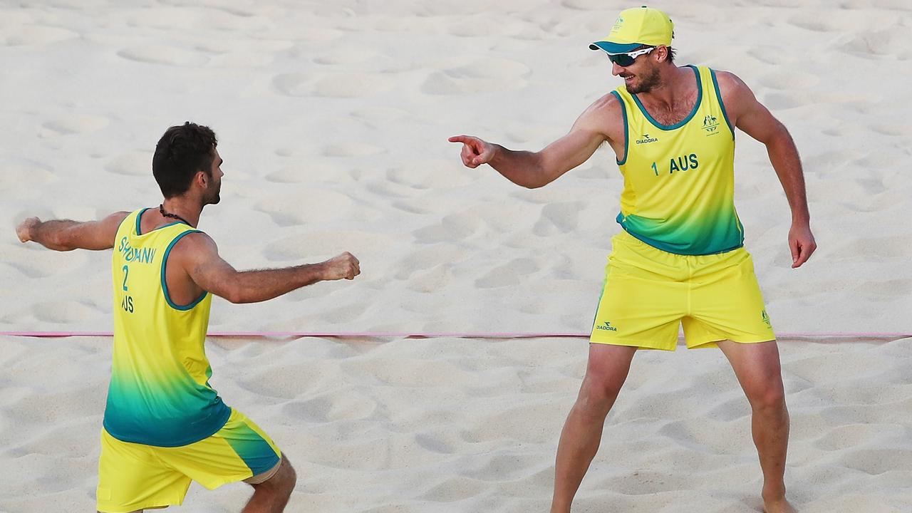 Australia’s Damien Schumann (left) and Christopher McHugh celebrate winning a point in their semi-final against England.