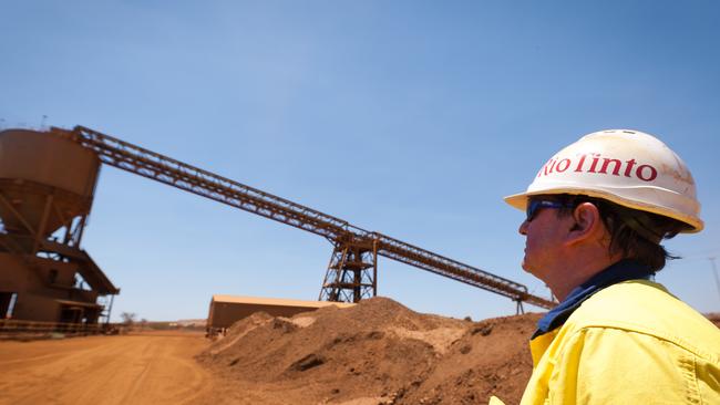 A mine worker looks at a train loader at Rio Tinto Group's West Angelas iron ore mine in Pilbara. Picture: Bloomberg