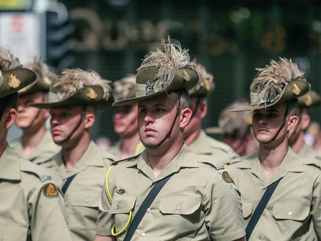 BRISBANE, AUSTRALIA - NCA NewsWire Photos - 25 APRIL 2023:  Thousands Line Adelaide St in Brisbane for the 2023 ANZAC Day March.Picture: NCA NewsWire / Glenn Campbell