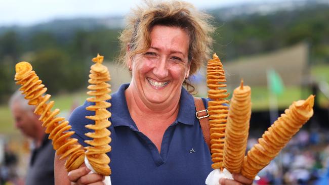 Gloria Doggetti holds chips on sticks at Rooty Hill, at last year’s celebration. Food trucks will return once again for the event. Picture: Angelo Velardo