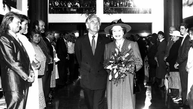 Queen Elizabeth II is escorted by Bob Hawke inside Members Hall during inspection of the new Parliament House in Canberra in 1988.