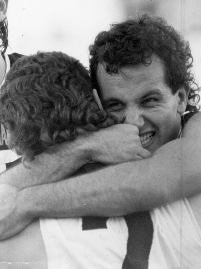 George Fiacchi hugs Tim Ginever after a win in 1988. Picture: Ray Titus