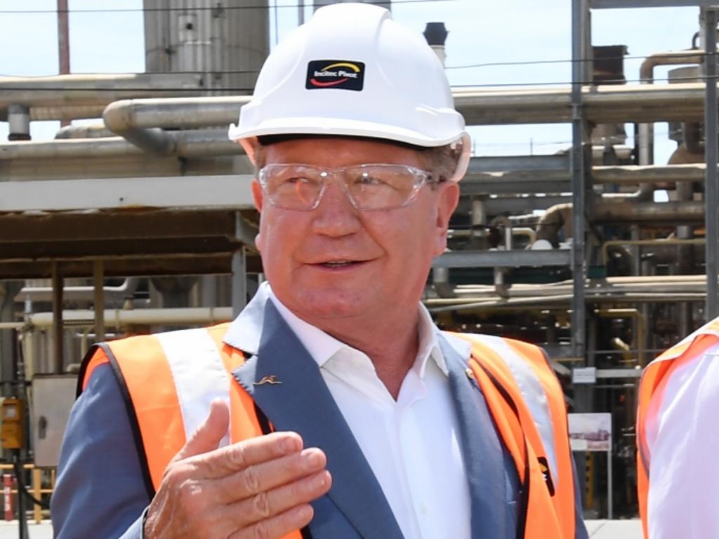 Queensland Premier Annastacia Palaszczuk (left), Andrew 'Twiggy' Forrest (centre) from Fortescue Future Industries and Deputy Premier Steven Miles (right) are seen during a hydrogen announcement at Incitec Pivot on Gibson Island in Brisbane, Monday, October 11, 2021.. The Queensland government announced that Incitec Pivot has reached an agreement with Fortescue Future Industries to study the feasibility of green ammonia production at Incitec Pivot's Gibson Island production facility in Brisbane. (AAP Image/Darren England) NO ARCHIVING