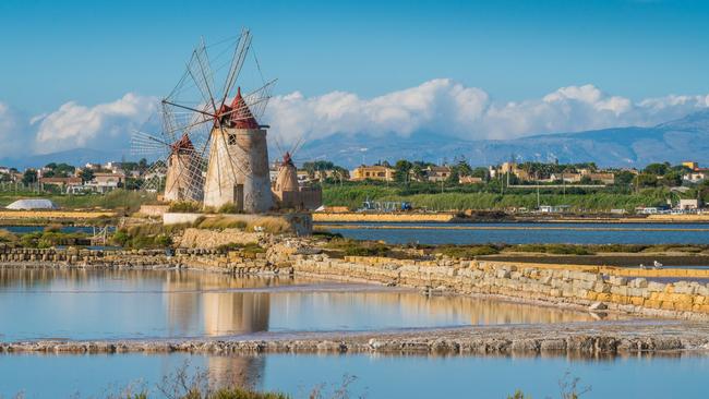 Windmills at a natural reserve near Marsala, Sicily.