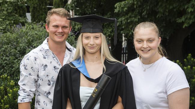 Bachelor of Paramedicine graduate Lana Broughton with partner Michael Eiser and sister Heidi Broughton at a UniSQ graduation ceremony at Empire Theatres, Tuesday, February 13, 2024. Picture: Kevin Farmer