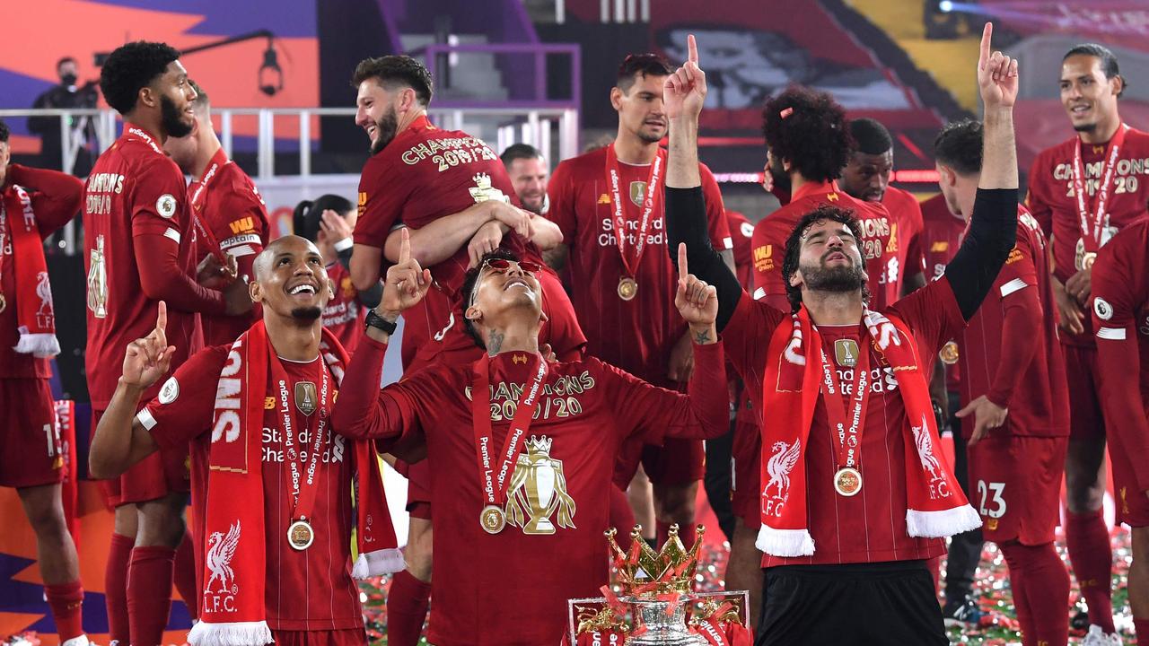 Liverpool’s Brazilian trio of Fabinho, Firmino and Alisson (L-R) celebrating the Premier League title.