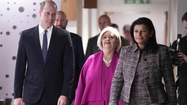 Prince William is guided by chair Liz Padmore, centre, and Beatrice Butsana-Sita, British Red Cross CEO. Picture: Getty Images