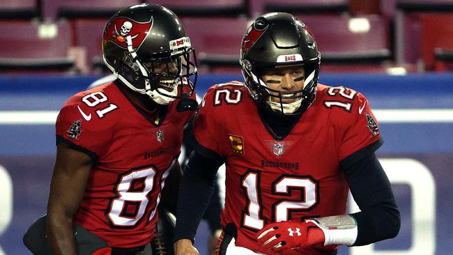 Quarterback Tom Brady #12 of the Tampa Bay Buccaneers congratulates wide receiver Antonio Brown #81. (Photo by Patrick Smith/Getty Images)