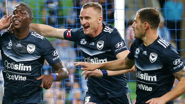 Melbourne Victory’s Leroy George (left) celebrates his second half goal with teammates Besart Berisha (centre) and James Troisi.