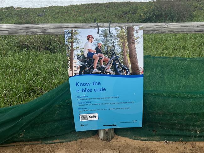 A sign made by Northern Beaches Council encourages teens to “know the e-bike code”. The code encourages riders to “slow down to walking pace” when passing people, to use your bell when appropriate and “be ready” for sudden changes. Picture: Daniel Peters / news.com.au