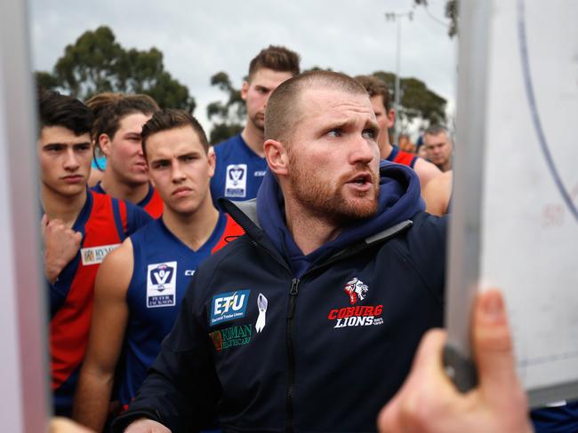 Coburg coach Leigh Adams issues instructions to his side.