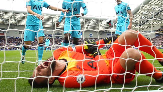 BRIGHTON, ENGLAND - OCTOBER 05: Hugo Lloris of Tottenham Hotspur goes down injured during the Premier League match between Brighton & Hove Albion and Tottenham Hotspur at American Express Community Stadium on October 05, 2019 in Brighton, United Kingdom. (Photo by Bryn Lennon/Getty Images)