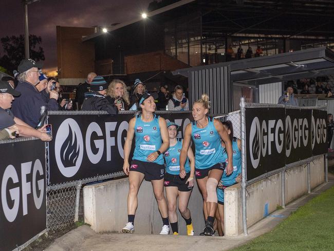 Angela Foley and Erin Phillips of Port Adelaide lead the team out the race during the first AFLW Port Adelaide training session at Alberton Oval. Picture Mark Brake