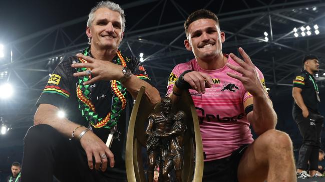 SYDNEY, AUSTRALIA - OCTOBER 06:  Nathan Cleary (R) of the Panthers poses with the Provan-Summons Trophy alongside his father and coach Ivan Cleary after winning the 2024 NRL Grand Final match between the Melbourne Storm and the Penrith Panthers at Accor Stadium on October 06, 2024, in Sydney, Australia. (Photo by Cameron Spencer/Getty Images)