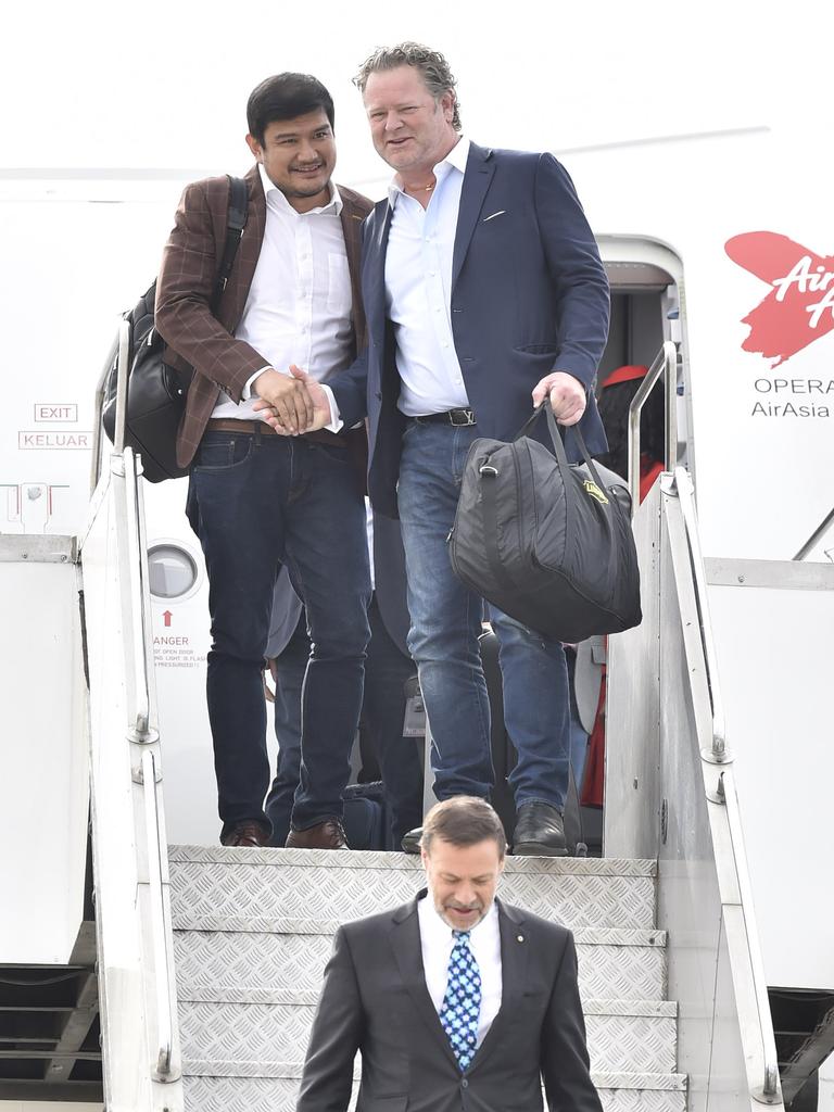 In happier times: David Fox of Linfox, left, with Air Asia CEO Benjamin Ismail. To the front of them is Andrew Goledzinowski, Australian High Commissioner to Malaysia. First Avalon International flight lands. Picture: Alan Barber