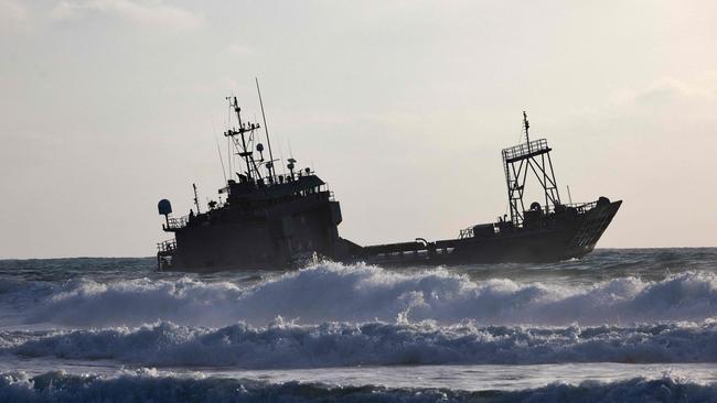 A US military vessel supporting a temporary pier runs aground. Picture: AFP.