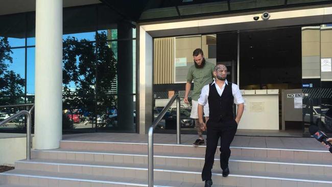 Nathan Leonard Richards, wearing a vest and with face tattoos, walks from Maroochydore District Court after being given immediate parole for an attack on a security guard at Kawana Shoppingworld. . Picture: Stuart Cumming