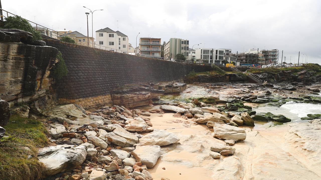 Shifting sands at the northern end of Maroubra beach have exposed a rocky canyon. Picture: John Grainger