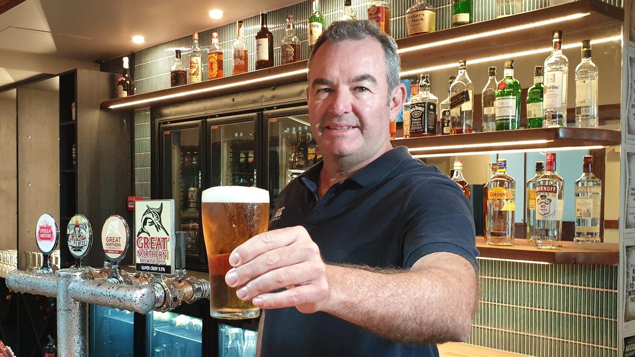 Duporth Tavern owner Clayton Williams pouring the first beer to celebrate the venue's $2.5 million revamp.