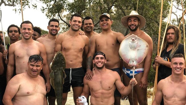 Latrell Mitchell (backrow holding stingray) at an Indigenous leadership camp.