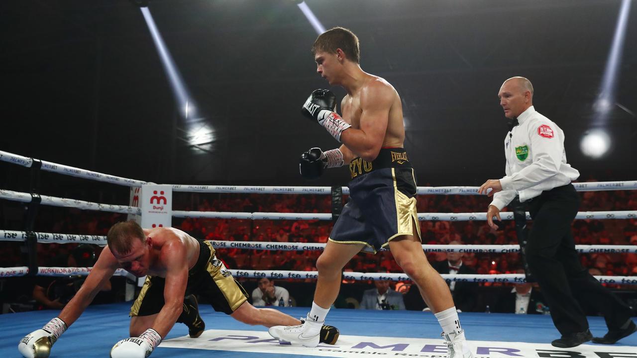 Nikita Tszyu knocks down Aaron Stahl during the Super Welterweight bout at Nissan Arena. Photo: Getty Images