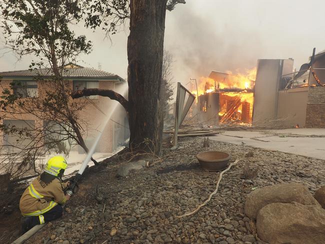 Firefighters battled to save what they could. Picture: John Ford