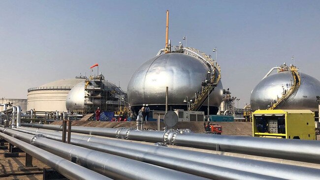 Three-phase spheroids stand behind pipelines at Saudi Aramco's crude oil processing facility, in Abqaiq, Saudi Arabia. Picture: Dina Khrennikova/Bloomberg