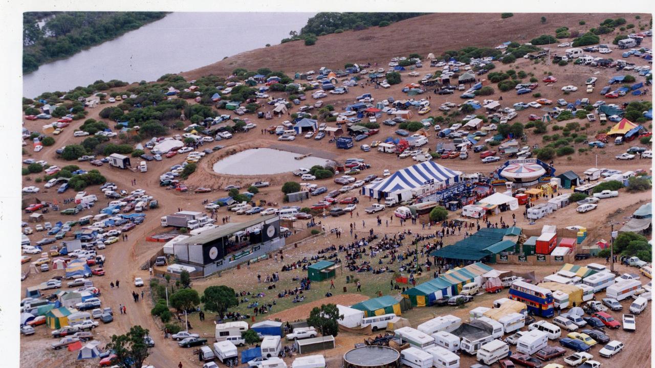 Aerial view of music fans, campsites and motor cars at Ponde rock music festival, held by the Hell’s Angels Motorcycle Club in Ponde near Mannum, SA, 1993.