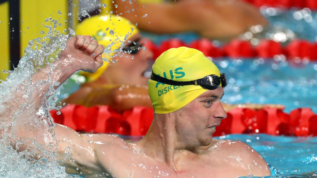 Matthew Disken celebrates his victory S9 100m freestyle