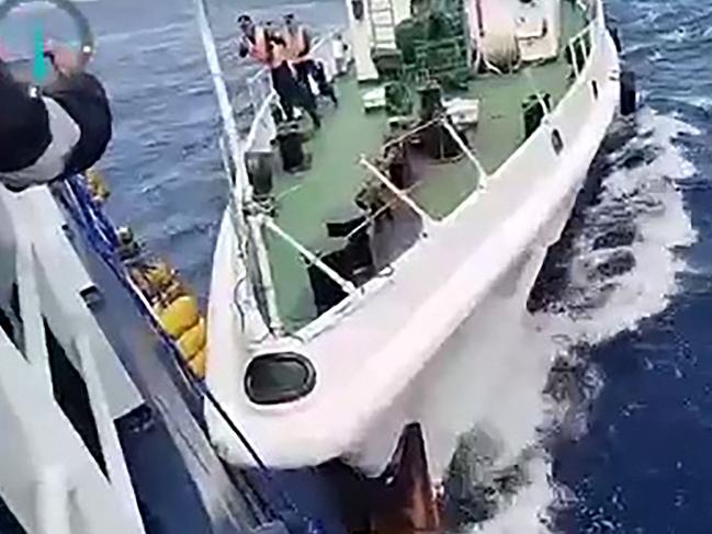 TOPSHOT - This frame grab from handout video footage taken and released on August 25, 2024 by the Philippine Coast Guard (PCG) shows a Chinese coast Guard ship (R) in a collision with the Philippine Bureau of Fisheries and Aquatic Resources (BFAR) vessel BRP Datu Sanday, near Sabina Shoal in disputed waters of the South China Sea. China's coast guard said it rescued Filipino "personnel" who fell overboard August 25 after a Philippine vessel collided with one of its ships near a disputed shoal in the South China Sea, while the Philippine government accused Chinese vessels of ramming and using water cannon against its ship. (Photo by Handout / Philippine Coast Guard (PCG) / AFP) / -----EDITORS NOTE --- RESTRICTED TO EDITORIAL USE - MANDATORY CREDIT "AFP PHOTO / PHILIPPINE COAST GUARD (PCG) " - NO MARKETING - NO ADVERTISING CAMPAIGNS - DISTRIBUTED AS A SERVICE TO CLIENTS