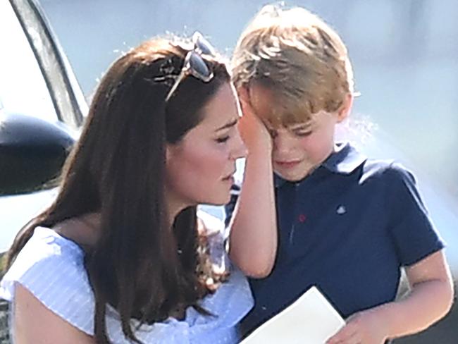 An upset Prince George gets cuddles from his mum, Catherine, Duchess of Cambridge. Picture: James Whatling/Mega