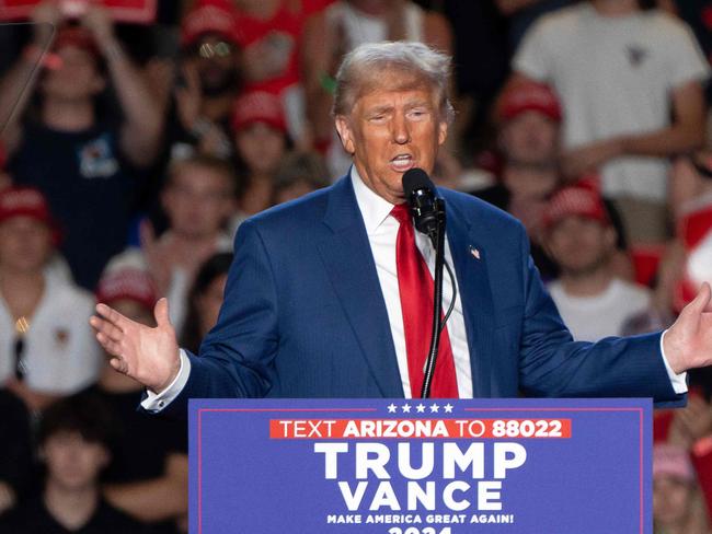 (FILES) Former US President and Republican presidential candidate Donald Trump speaks during a campaign rally at Mullet Arena in Tempe, Arizona on October 24, 2024. Donald Trump won the state of Arizona in this week's US presidential election, US TV networks projected on November 9, 2024, completing the Republican's sweep of all seven swing states. (Photo by Rebecca NOBLE / AFP)