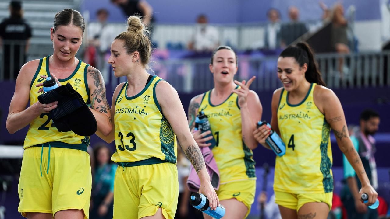 Australia's team celebrates after winning the women's pool round 3x3 basketball game between Australia and Azerbaijan. (Photo by David GRAY / AFP)