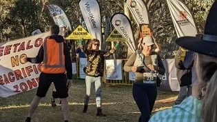 Central Australian Frack Free Alliance protesters voiced their concerns against fracking next to Chief Minister Natasha Fyles in Alice Springs over the weekend. Picture: CAFFA