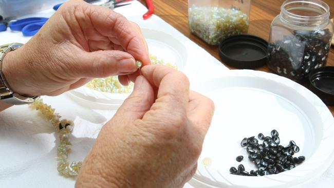 The ancient art of Aborginal shell-stringing by Tasmanian craftswoman Jeanette James. Picture: Richard Jupe