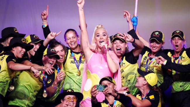 The victorious Aussies get down with Katy Perry on stage.