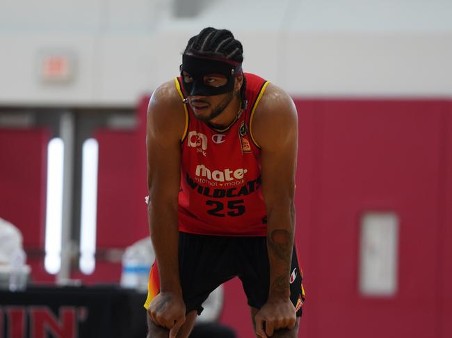 Keanu Pinder trains in a plastic face mask.