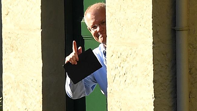 Scott Morrison gestures to media at Kirribilli House this morning. Picture: AAP