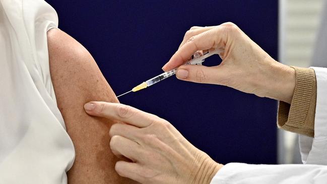 A woman is given a dose of the Pfizer-Biontech Covid-19 vaccine in Vienna, Austria, as the European Union began its rollout. Picture: AFP