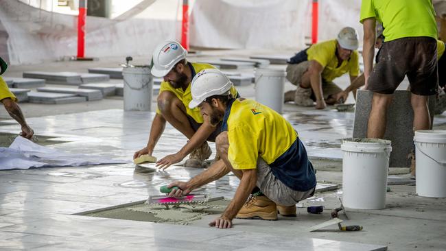 Tiling being laid in the centre Picture: Jerad Williams