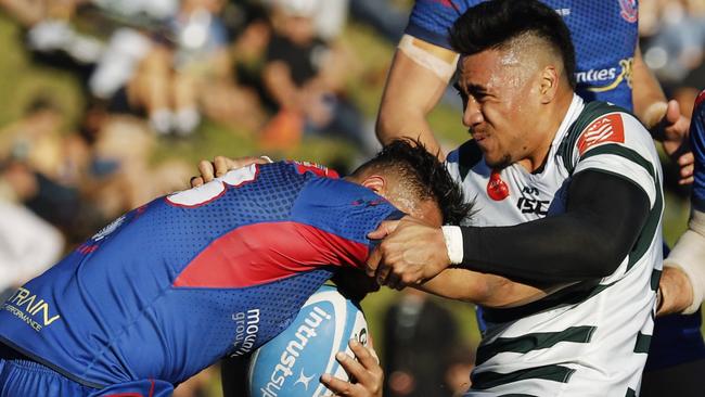 Warringahâ€™s Charlie Tupu seizes Manlyâ€™s Dennis Pili-Gaitau as Manlyâ€™s Alex Dalzell comes in to support. Warringah v Manly (Northern Beaches Derby 2), Shute Shield Rd 16 at Pittwater Rugby Park. Rats def Marlins 28-23. Saturday 20th July 2019.  Â© Karen Watson