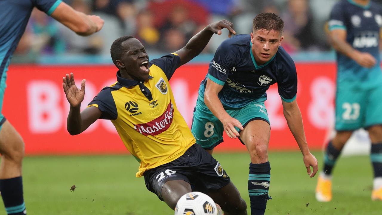 Mariners striker Alou Kuol is challenged by Wellington’s Cameron Devlin. Picture: Ashley Feder/Getty Images