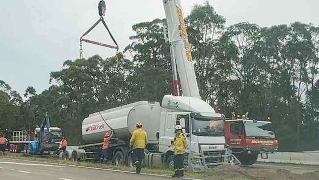 Truck stuck on median strip on Pacific Hwy north of Newcastle.