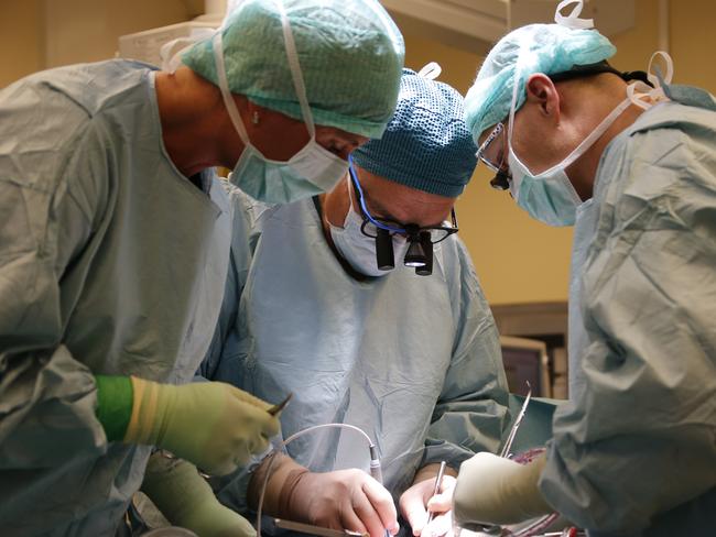 The Swedish team and Australian Associate Professor Ash Hanafy performing a womb transplant surgery.