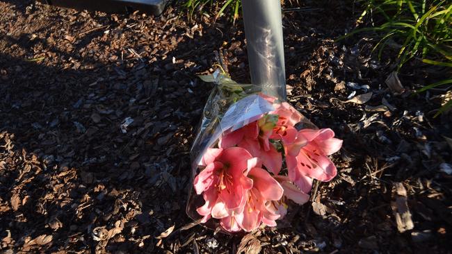 A bunch of flowers left at scene where a little girl was killed in a Nambour car park.