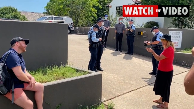 Anti-vaxxers at Parliament House protest turn on one-another