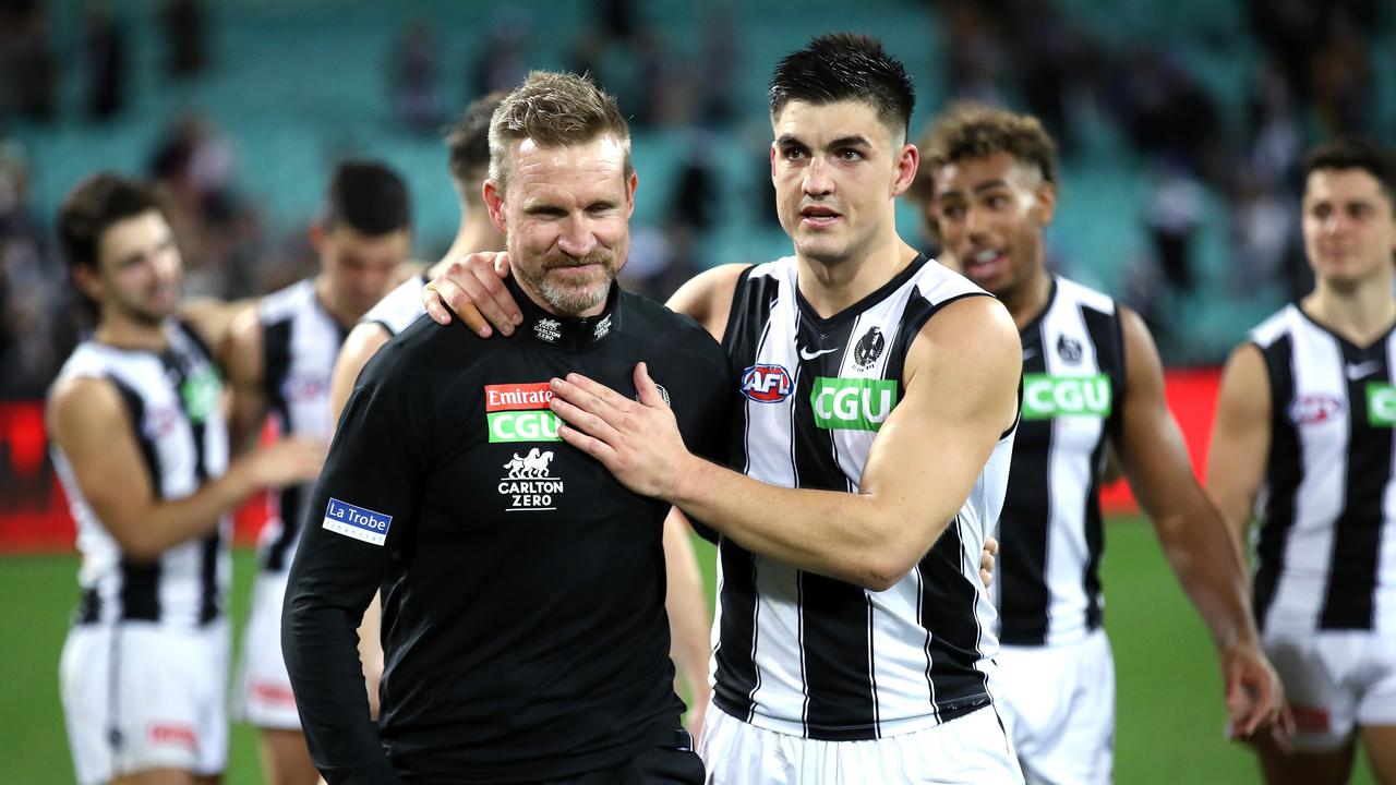 Nathan Buckley is embraced by Brayden Maynard after his last game as Collingwood coach.